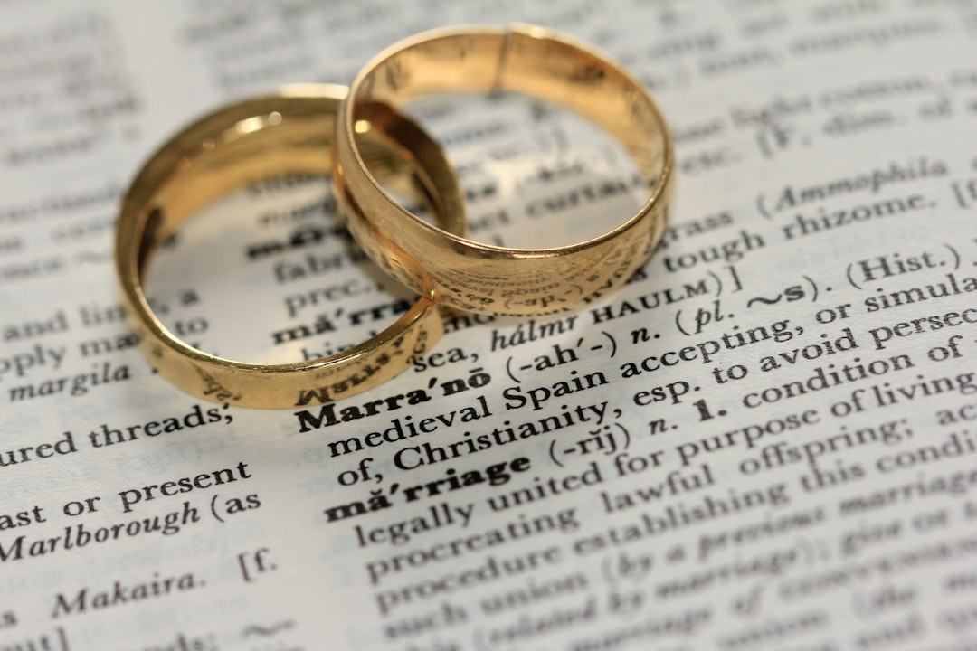 Two gold wedding rings resting on a document, symbolising divorce and separation under Australian family law